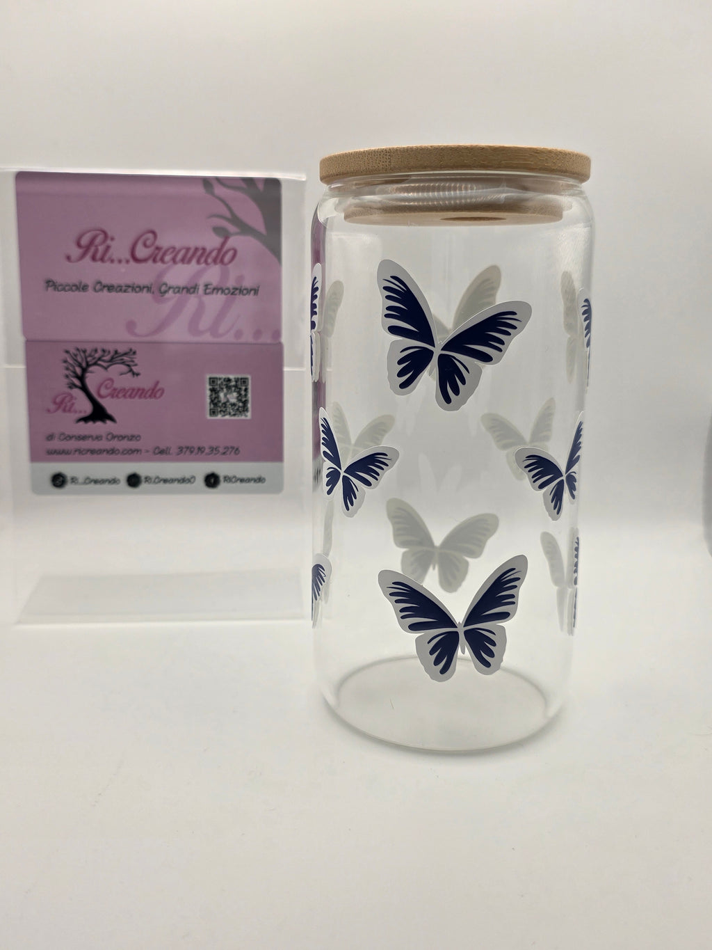 Glass cup with butterflies