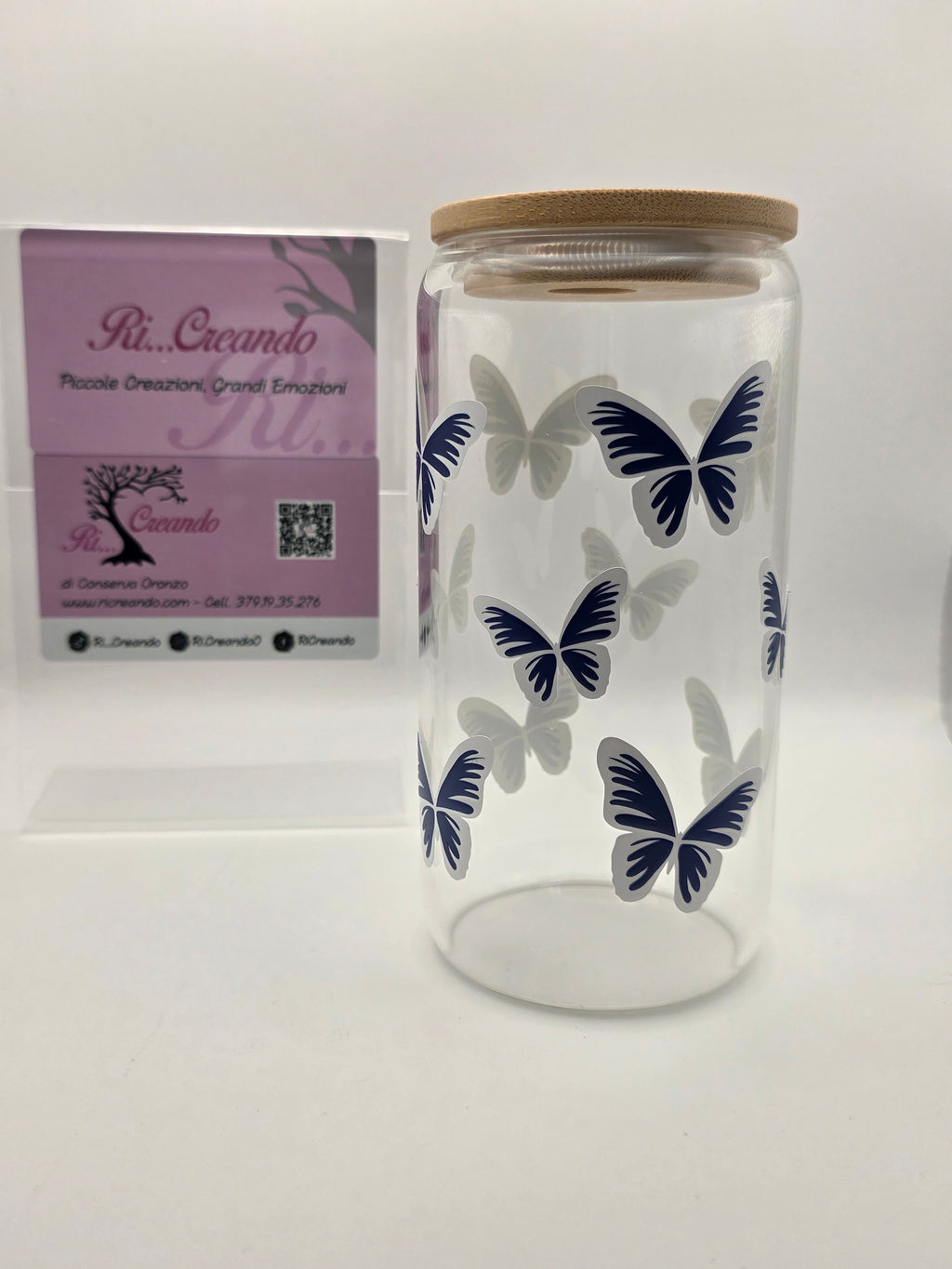 Glass cup with butterflies